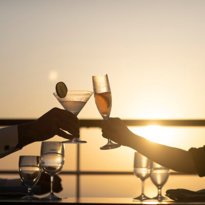 Guests having a drink at sunset on the Silver Moon.